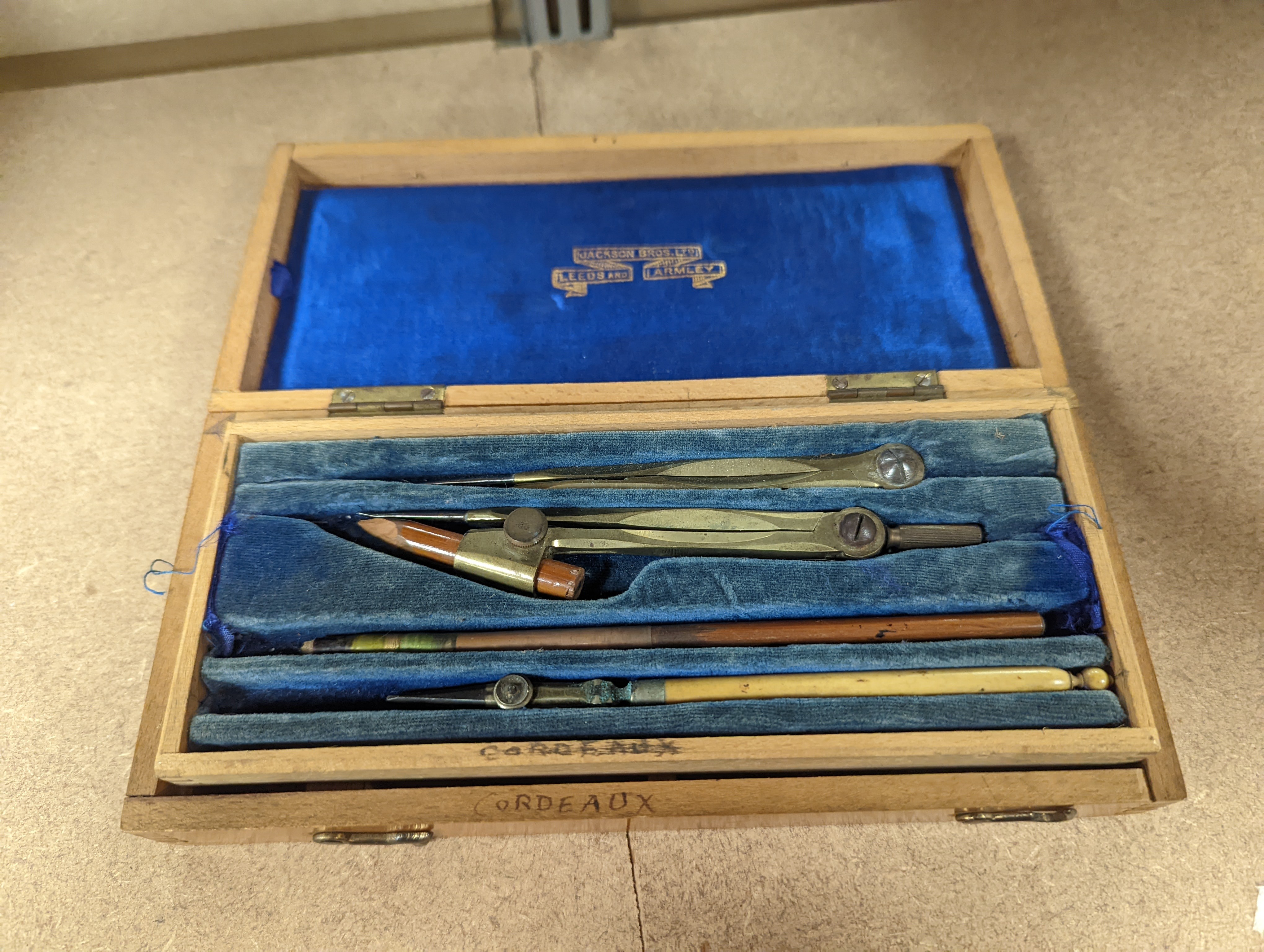 A collection of mahogany cased drawing instruments (8)